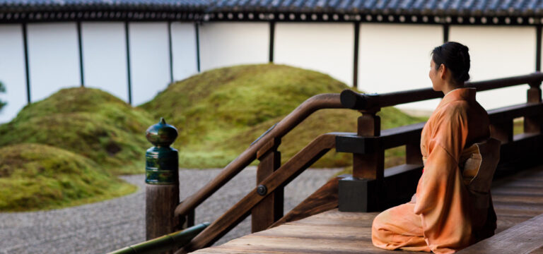 Zen - Japanese woman looking at garden